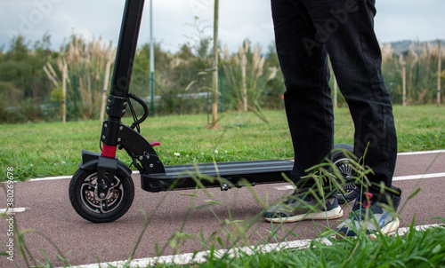 legs of man with electric scooter