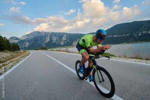 Fototapeta Naklejka Na Ścianę i Meble -  triathlon athlete riding bike