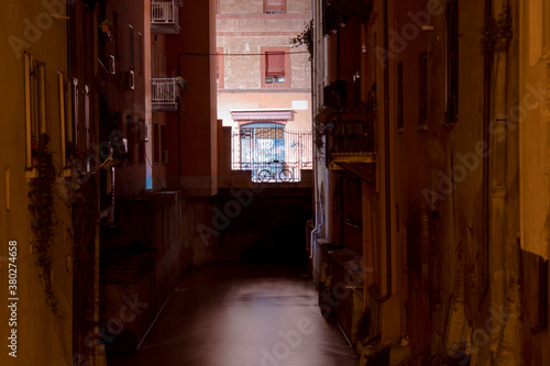 Finestrella, via Piella. Bologna Italy. Passing under the Porta Govese or Torresotto dei Piella you reach the famous window on the Canale delle Moline and the bridge, both overlooking the canal.  photo