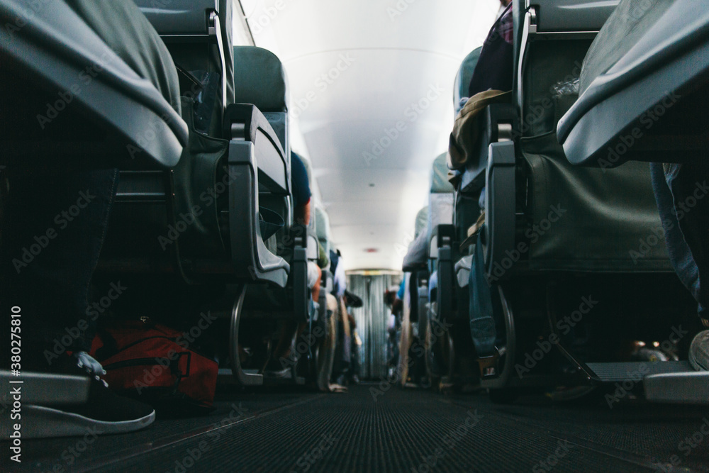 Corridor of airplane cabin and seats seen from low angle Stock Photo ...