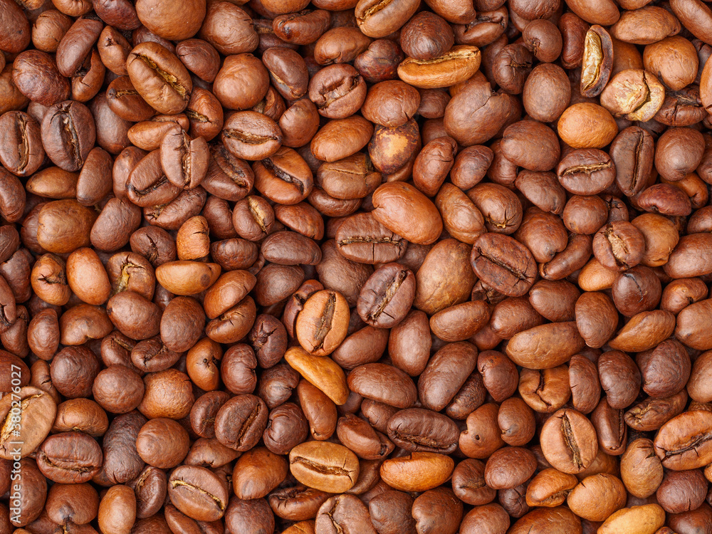 Fototapeta premium Roasted coffee beans closeup background, texture