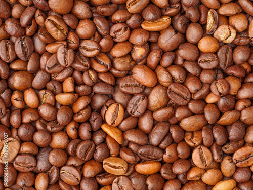 Roasted coffee beans closeup background, texture