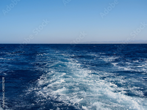 Cruise ship wake on the sea surface, ocean boat foam trail
