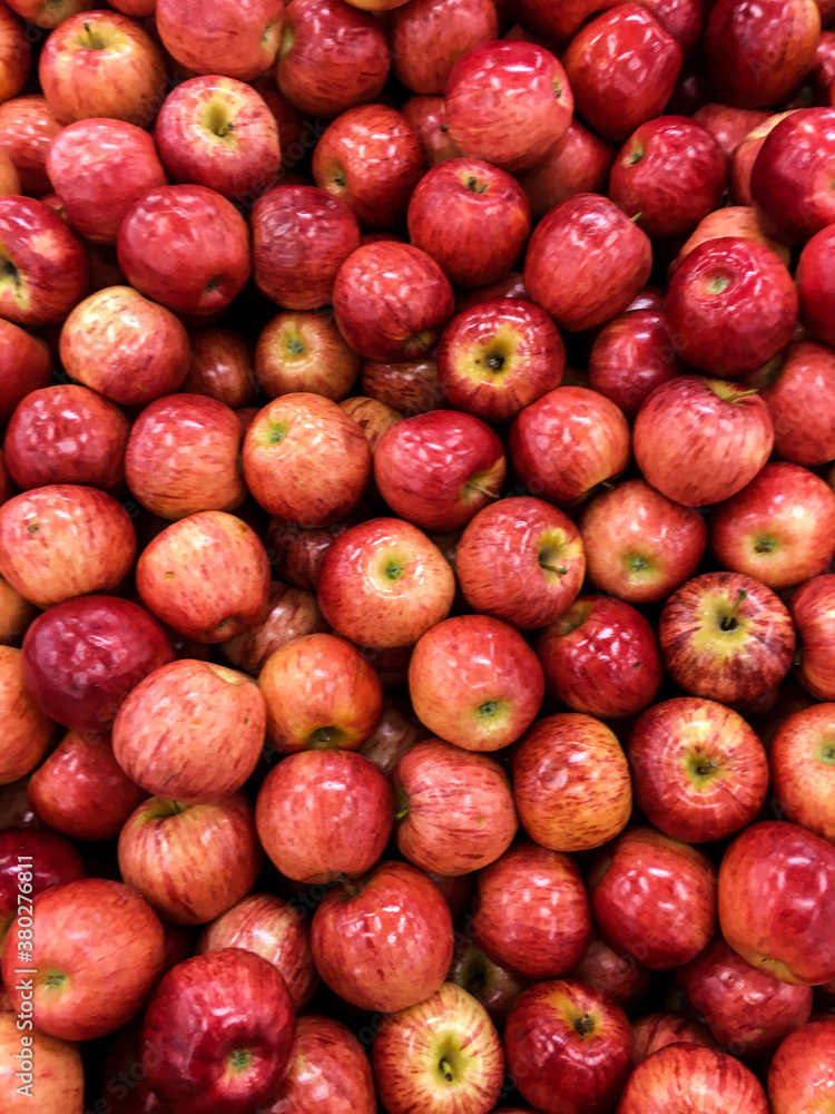 Red apples are on the shelves of the store Red apples are on the shelves of the store
