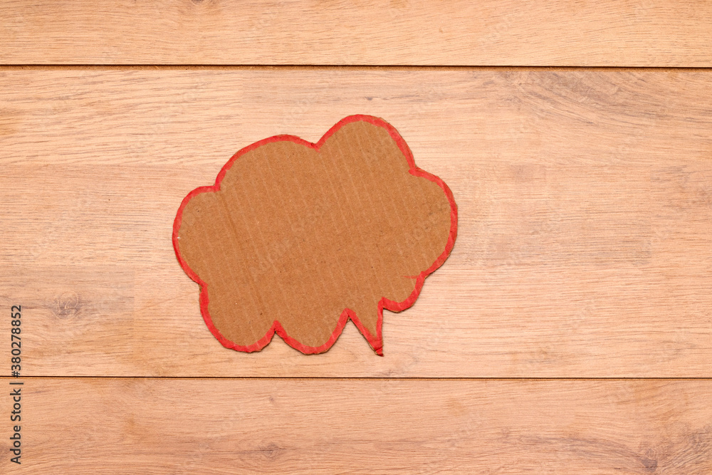 cardboard Speech Bubble on wooden table cardboard Speech Bubble on wooden table
