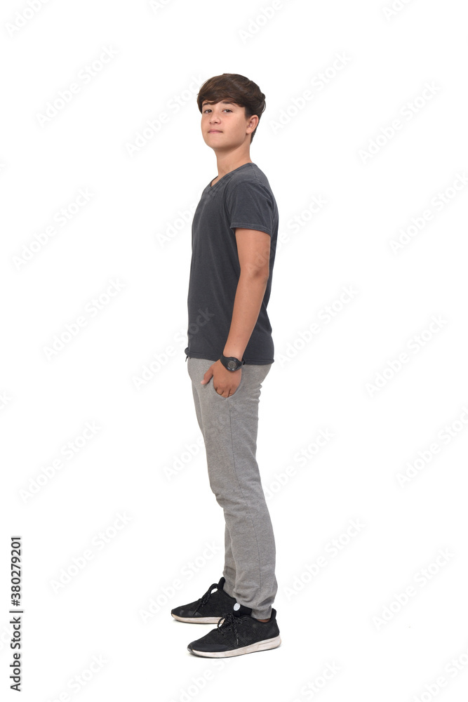 full portrait of a teenage boy dressed in sportswear on white background, side view full portrait of a teenage boy dressed in sportswear on white background, side view