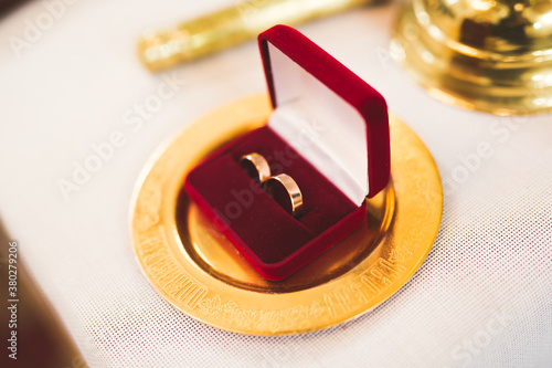 Two golden wedding rings isolated background concept © olegparylyak