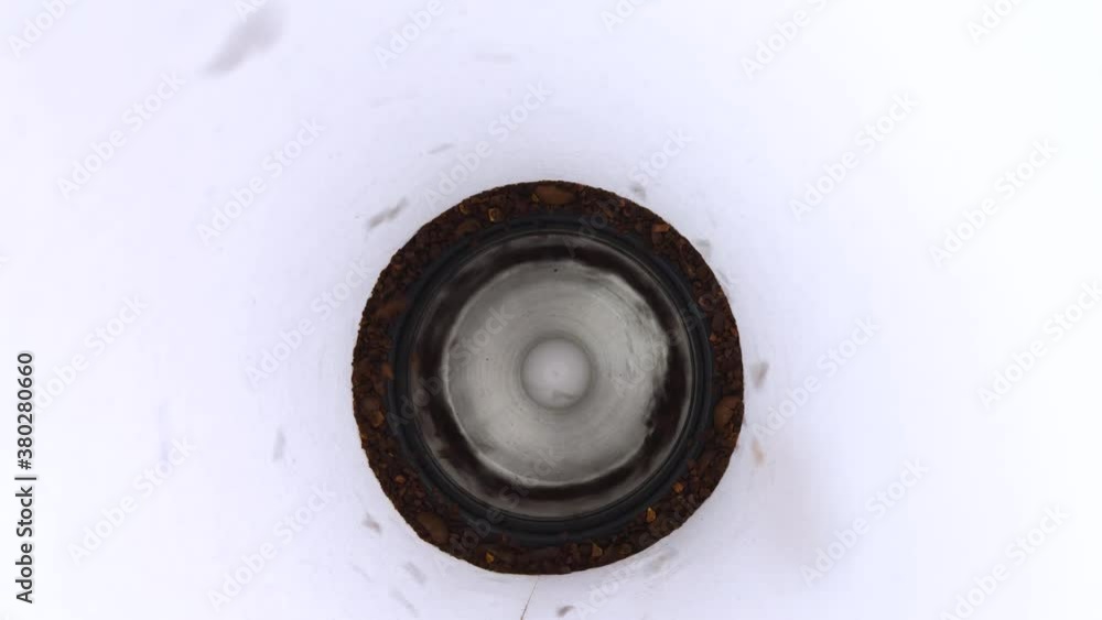 The electric coffee grinder works with the lid open. Macro video of ground grains that create a vortex and are drawn towards the camera. Isolated on white. The electric coffee grinder works with the lid open. Macro video of ground grains that create a vortex and are drawn towards the camera. Isolated on white.
