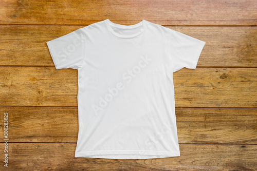 White t-shirt mockup on wood background template.