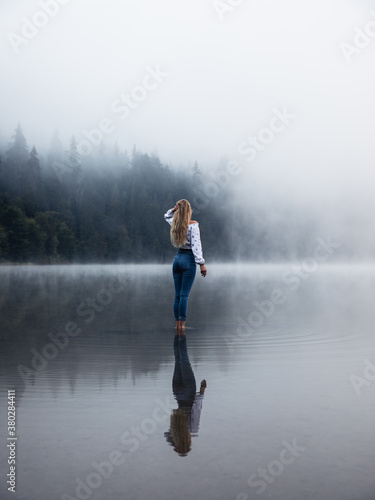 Young person standing in th...