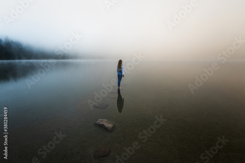 Young blonde girl standing ...