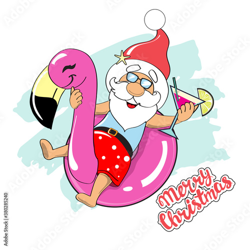 Funny Santa Claus swims on an inflatable flamingo and holds in his hands a cocktail and the inscription Merry Christmas. Christmas concept