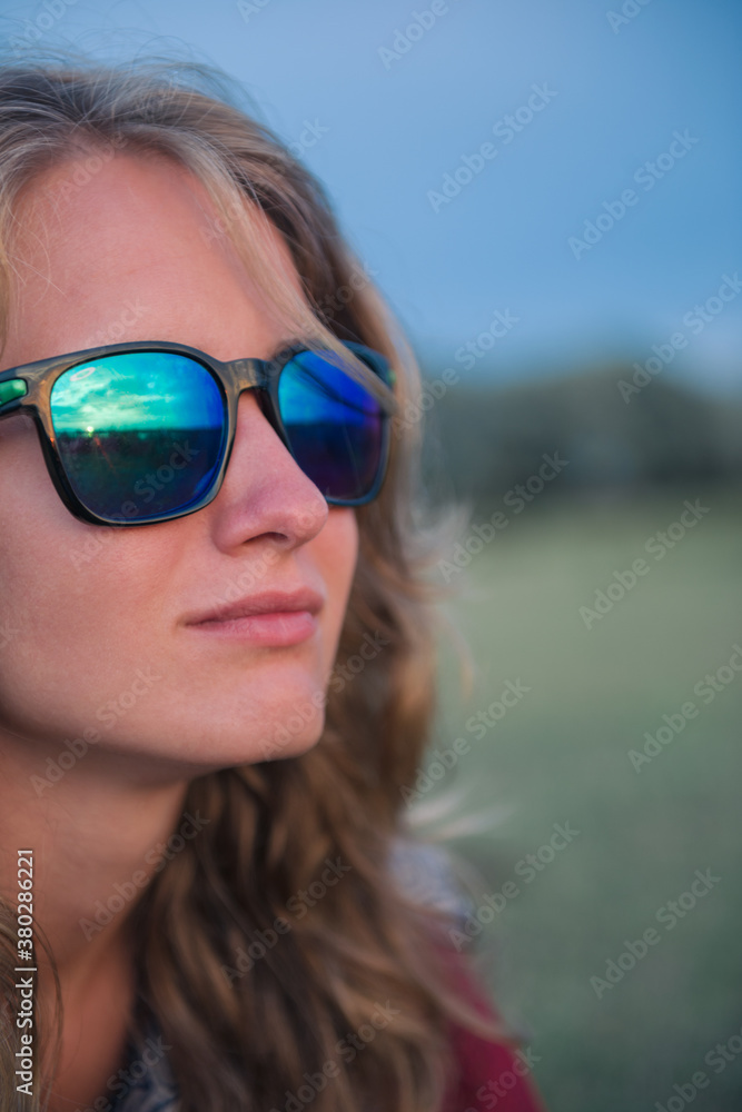 sunset reflected in sunglasses lens sunset reflected in sunglasses lens