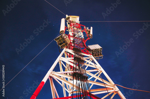 Telecommunication tower at night photo