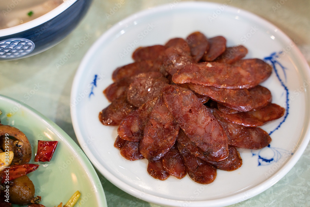 Close view of a set of sliced Sichuan sausages.