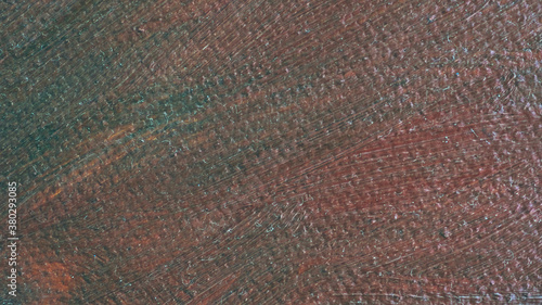 
Oil paint stains on the fabric. Defocused blurred background for web design.
