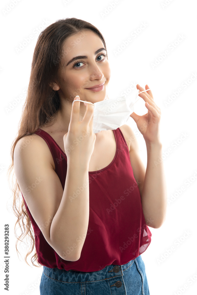 Young woman wearing medical face mask, studio portrait Young woman wearing medical face mask, studio portrait