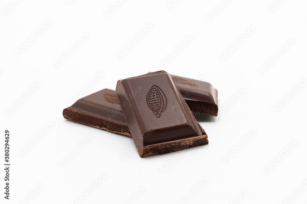 ounces of dark chocolate in front of white background ounces of dark chocolate in front of white background