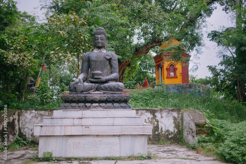 Buddha's statue outdoors inside a temple premises. Buddha's statue outdoors inside a temple premises.