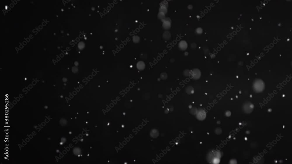 Falling snow background. Blur white flakes flicker motion isolated on black. Dark winter sky. Night blizzard. Defocused particles animation. Falling snow background. Blur white flakes flicker motion isolated on black. Dark winter sky. Night blizzard. Defocused particles animation.