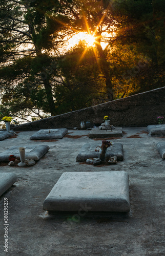 Cemetary and graves at Sunset with light beams looking like Heaven photo