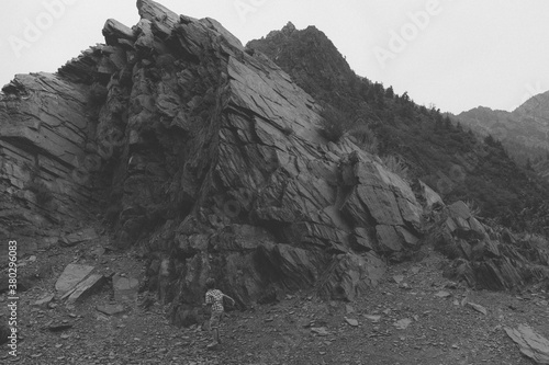 Young boy exploring ancient upheaved quartizite in BIg Cottonwood Canyon, Utah photo