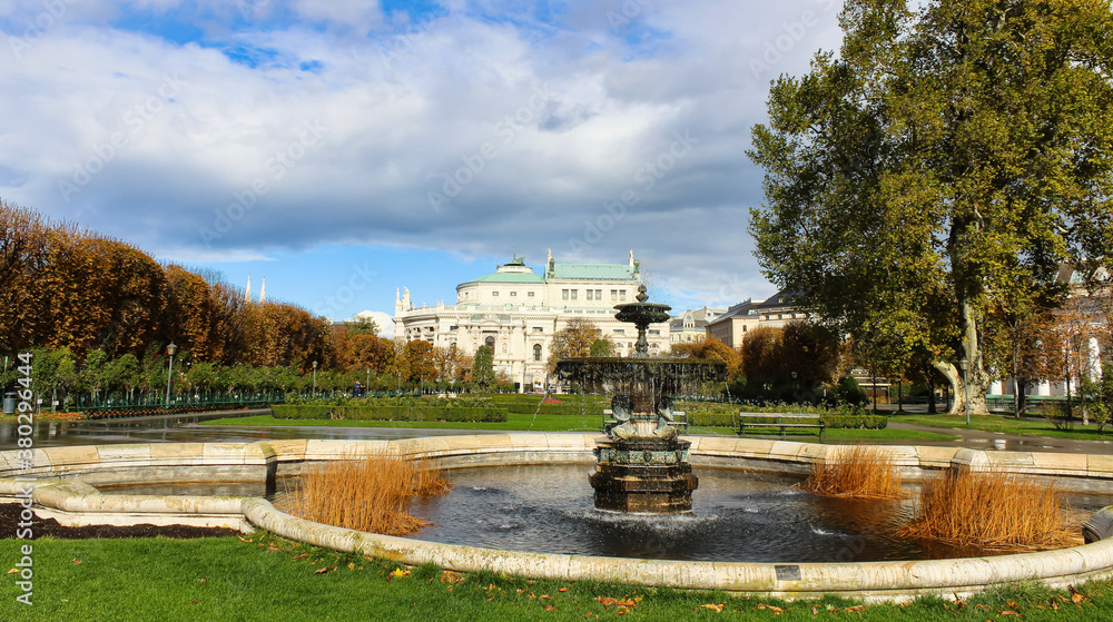 Vienna fountain, park, and Baroque architecture.