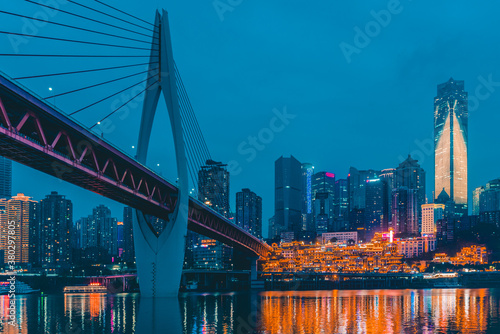Night view of the Qiansimen bridge and the skyline in Chongqing, China. photo