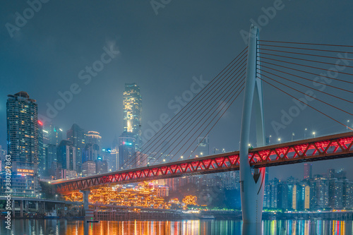 Night view of the Qiansimen bridge and the skyline in Chongqing, China.