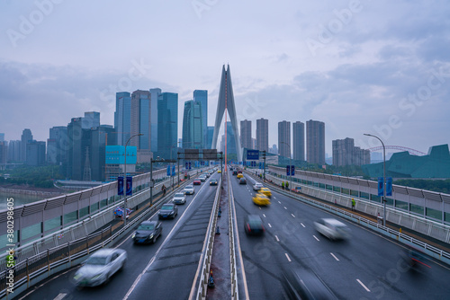 The traffic on qiansimen bridge, with the financial district in Chongqing, China, on a cloudy day.