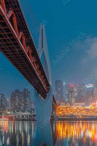 Night view of the Qiansimen bridge and the skyline in Chongqing, China. photo