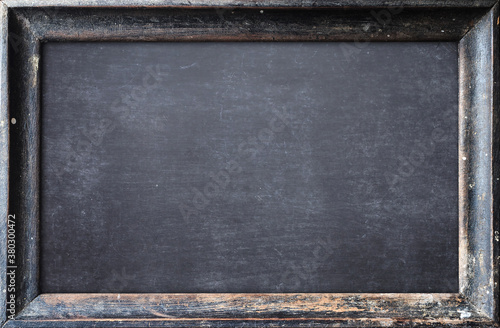 Teacher day concept: Grunge old wood blackboard