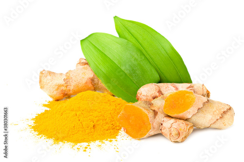 Turmeric powder with turmeric root isolated on white background.