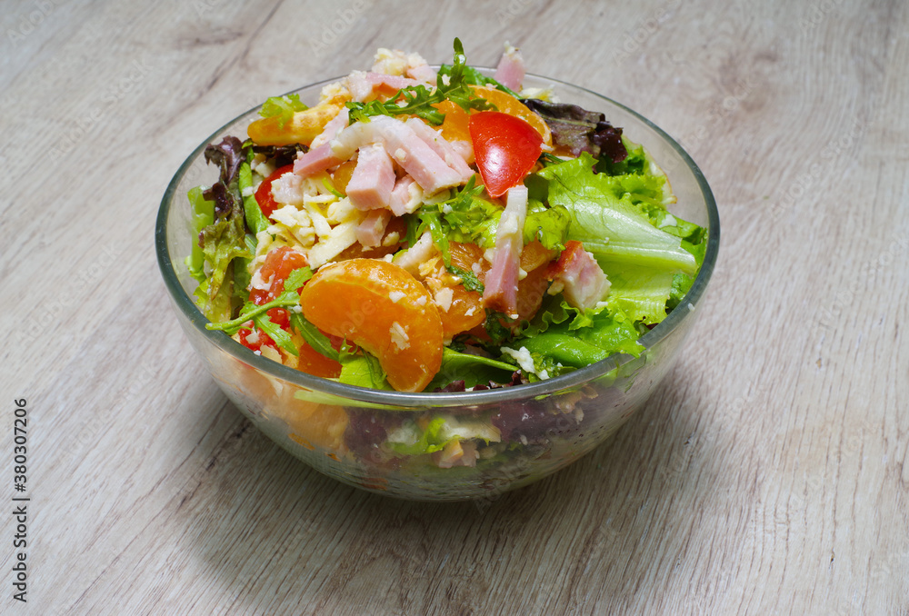 Salad with tangerine and ham Salad with tangerine and ham