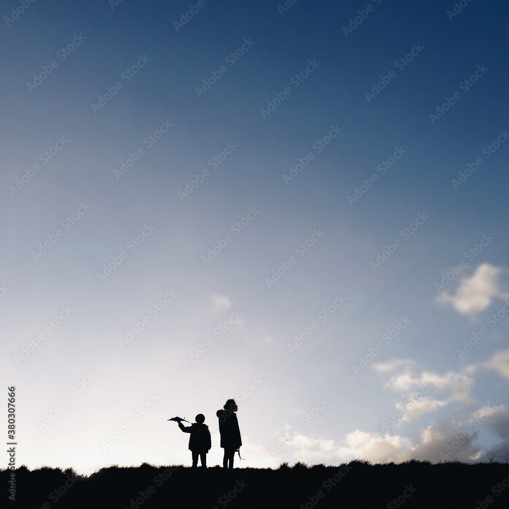 Silhouettes of two children in the winter. Silhouettes of two children in the winter.