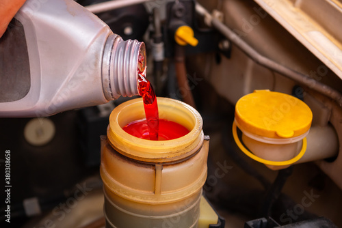 Add brake fluid to the car engine.