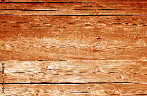 Old grungy wooden planks background in orange color.