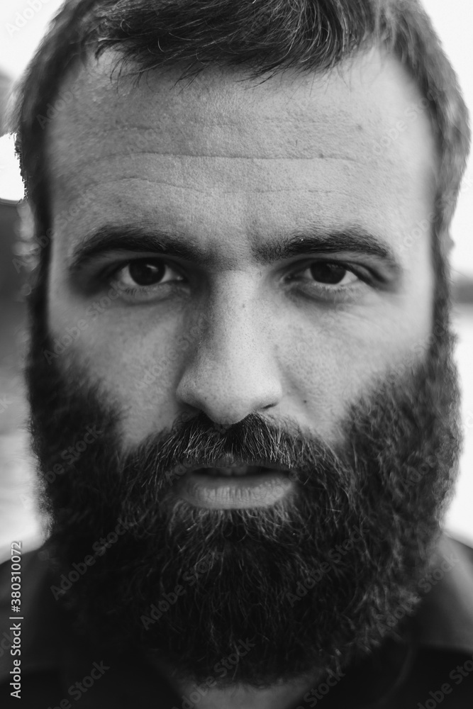 A portrait of a man with a bushy beard A portrait of a man with a bushy beard