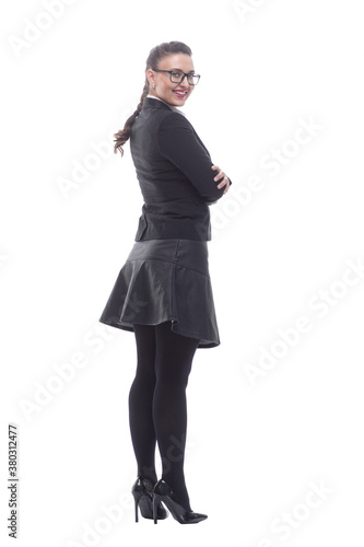 rear view. young business woman looking at a white blank screen.