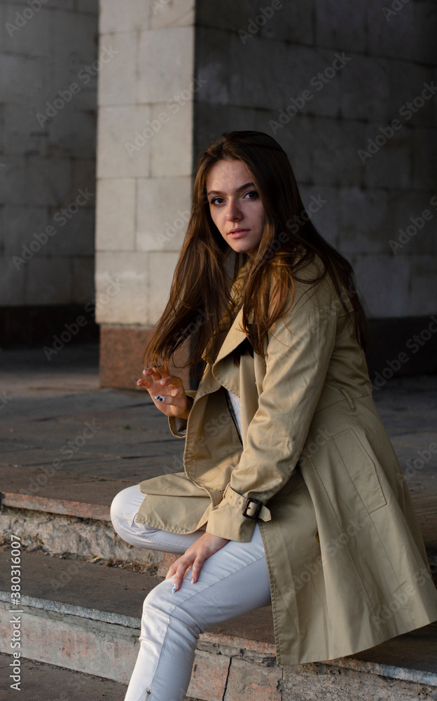 girl outdoors in autumn in a raincoat girl outdoors in autumn in a raincoat