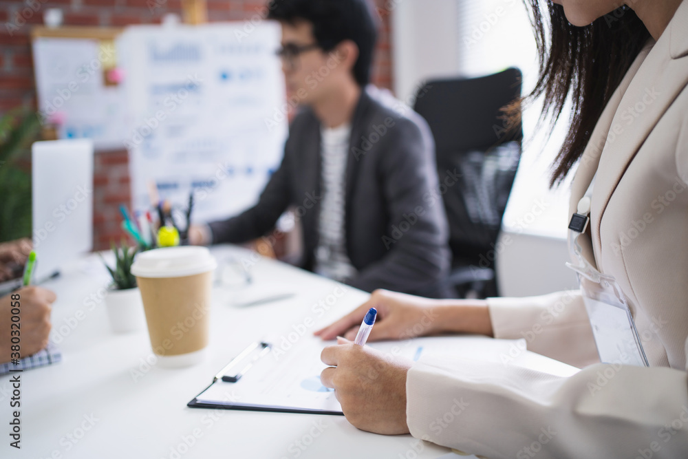 Fototapeta premium Asian group of business people working in office, they brainstorm ideas with work projects in the workplace.