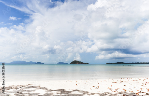Beautiful beach in tropical island with blue sky and white cloud.