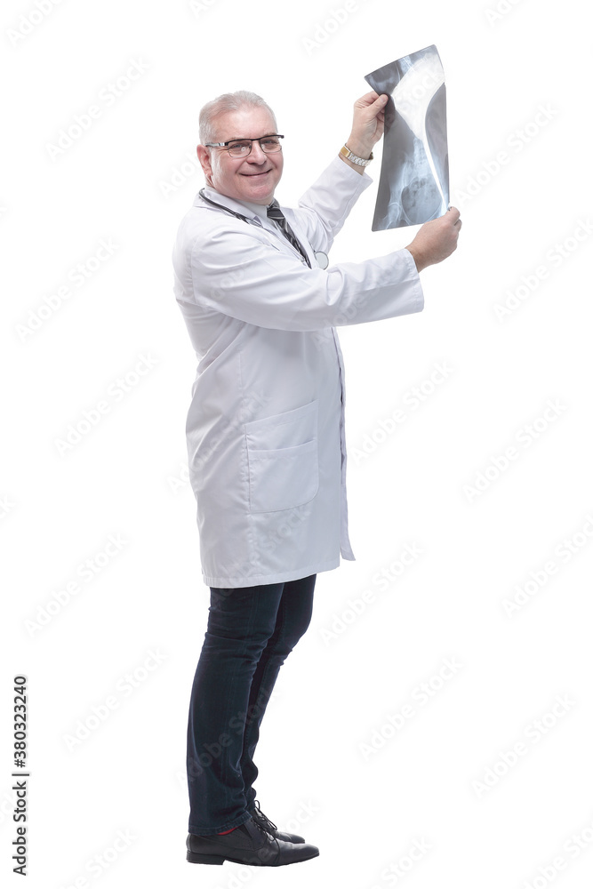 in full growth. smiling male therapist with an x -ray . in full growth. smiling male therapist with an x -ray .