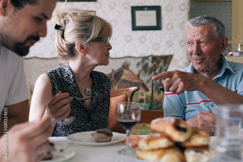 Family enjoying dessert after lunch photo