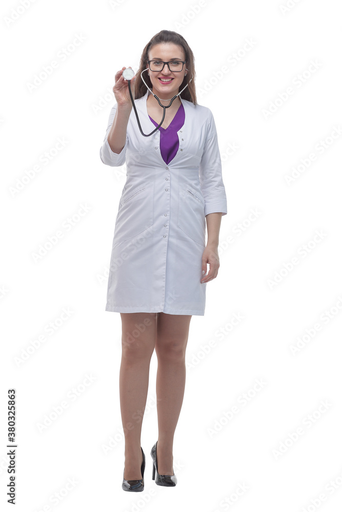 in full growth. smiling female doctor showing her stethoscope. in full growth. smiling female doctor showing her stethoscope.