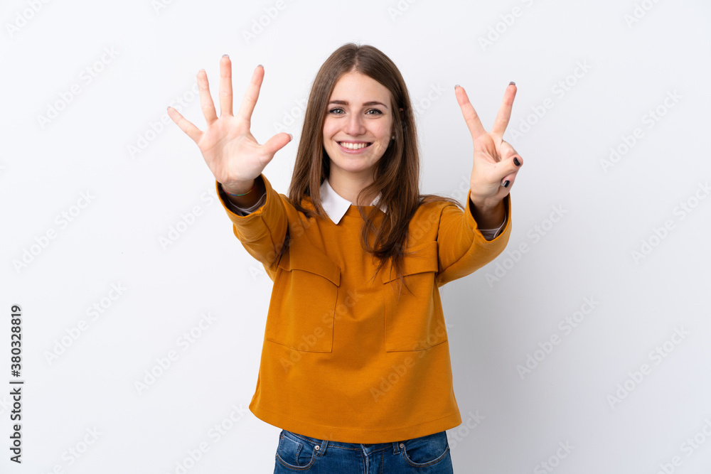 Young woman over isolated white background counting seven with fingers Young woman over isolated white background counting seven with fingers