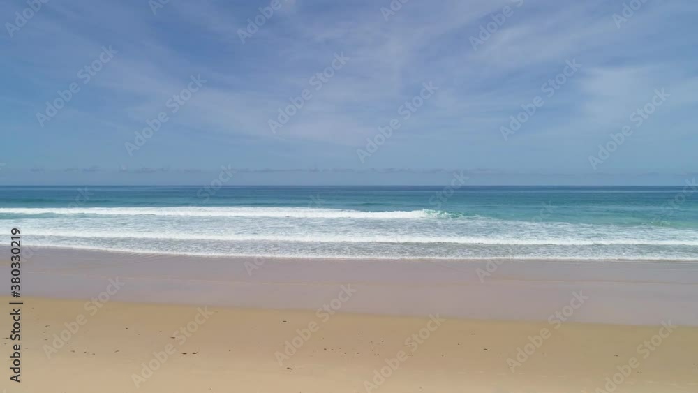 Aerial view drone camera of Beautiful tropical sea sandy beach empty and clean beach ,waves crashing against an empty sand beach from above at Phuket beach is famous tourist destination Aerial view drone camera of Beautiful tropical sea sandy beach empty and clean beach ,waves crashing against an empty sand beach from above at Phuket beach is famous tourist destination