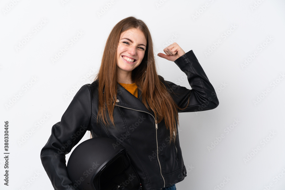 Woman with a motorcycle helmet making strong gesture Woman with a motorcycle helmet making strong gesture