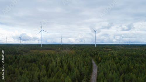 Aerial view of wind energy turbines on windfarm above. Clean energy. Finland.
 photo