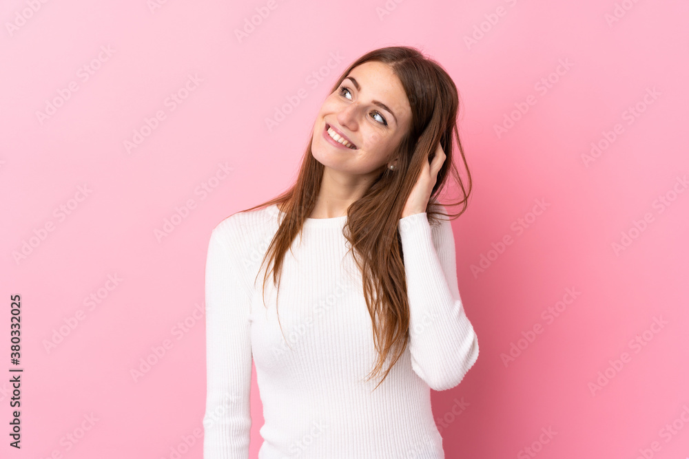 Young woman over isolated pink background thinking an idea Young woman over isolated pink background thinking an idea